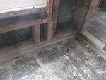 Asbestos dust-covered flood and walls
