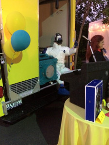Mannequin in a gas mask sitting inside a truck 